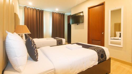Postel nebo postele na pokoji v ubytování Asrodel Hotel RedPartner