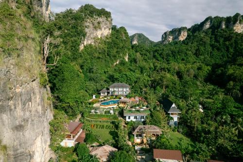 a resort in the middle of a mountain at Railay Phutawan Resort in Railay Beach