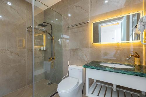 a bathroom with a shower and a toilet and a sink at B2.20 Hoàng Sơn in Vung Tau