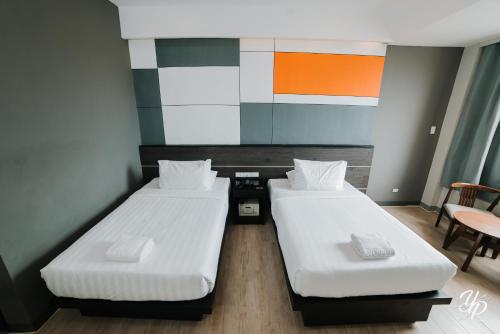 Postel nebo postele na pokoji v ubytování Hotel Marcelina