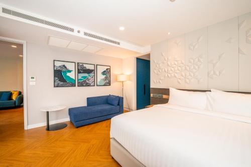 Una cama o camas en una habitación de Amanta Hotel & Residence Sathorn