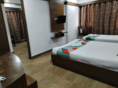 Säng eller sängar i ett rum på Khaleej Residency, Mount Road