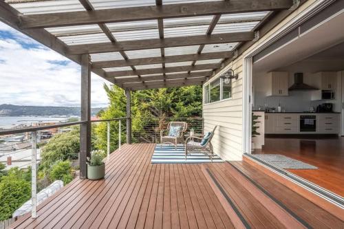 an outdoor deck with a view of the ocean at View Point: Ocean Views & Near CBD in Burnie