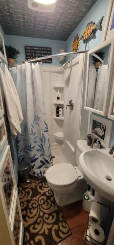 a bathroom with a toilet and a sink at Jazzy Studio in a GREAT Location in New Orleans