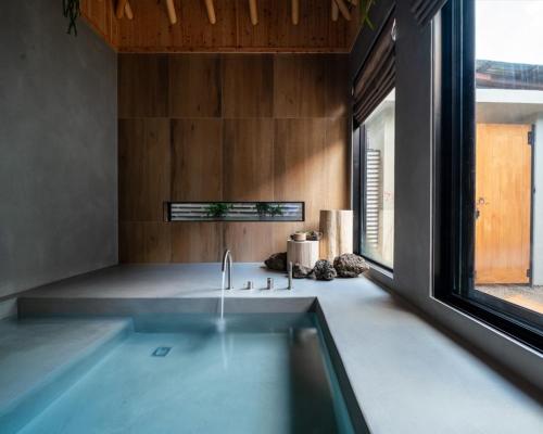 a kitchen with a sink and a window at Han Yul Jae - Hanok in Chuncheon