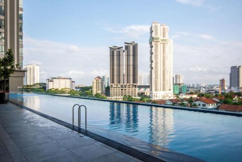 The swimming pool at or close to A Stylish & Cozy 2BR Apt in JB FREE Parking