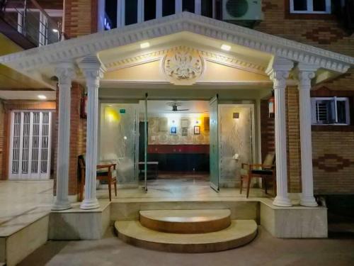 a room with a table and a bench in a building at Hotel Sterling , Srinagar in Srinagar