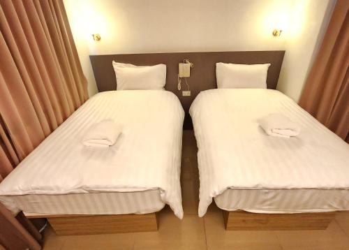Prom Ratchada Hotelにあるベッド