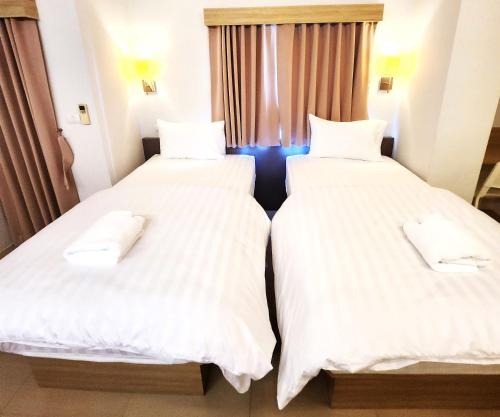 Prom Ratchada Hotelにあるベッド