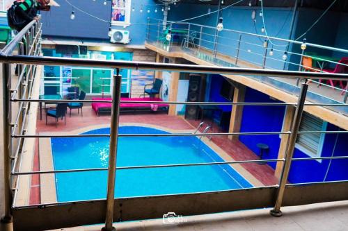 a view of a swimming pool in a building at FORTUNE PEARL HOTEL in Lagos