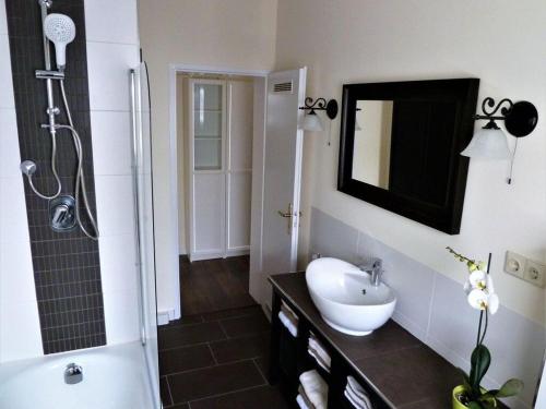 a bathroom with a sink and a shower at Holiday apartment Randersacker in Randersacker