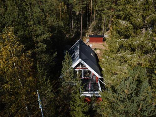 an aerial view of a house in the middle of a forest at Modern apartment in Vimmerby in Vimmerby