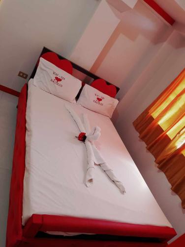 Ένα ή περισσότερα κρεβάτια σε δωμάτιο στο WJV INN BACOLOD