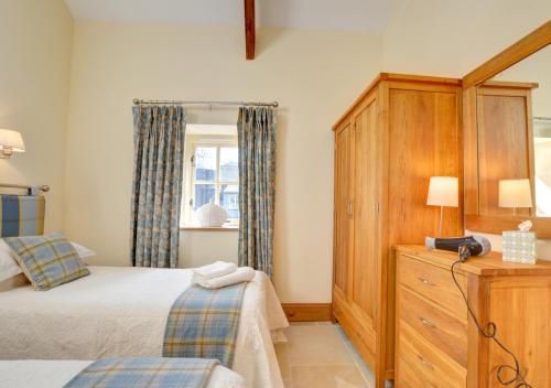 Postel nebo postele na pokoji v ubytování Bluebell Cottage