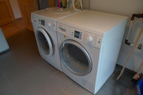 a white washing machine sitting in a room at W & S Executive Apartments - Hallstatt II in Hallstatt