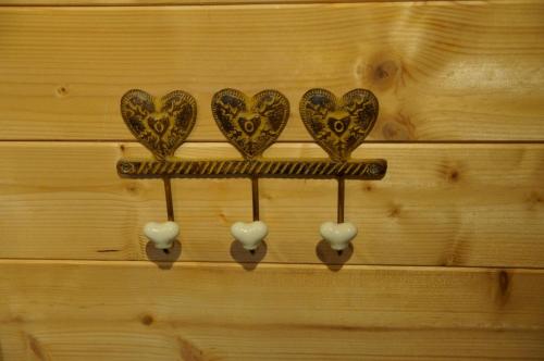 a group of hearts on a wooden wall at W & S Executive Apartments - Hallstatt II in Hallstatt