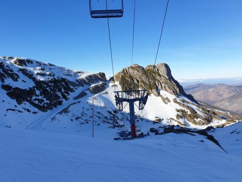 a ski lift on top of a snow covered mountain at Gîtes Estives d'Arrens in Arrens-Marsous