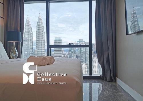 a hotel room with a bed and a large window at The Platinum 2 Kuala Lumpur By Collective Haus in Kuala Lumpur