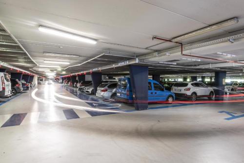 a parking garage with cars parked in it at Il Tenore B&B in Verona