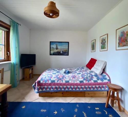 En eller flere senge i et værelse på Lepahn Holsteinische Schweiz