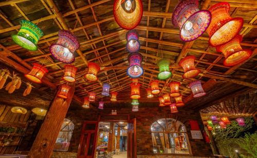 a bunch of colorful lights hanging from a ceiling at Sapaxa Spring Garden Ecolodge in Sa Pa