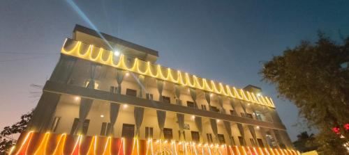 a building with a lot of lights on it at Hotel Amulya Regency in Bengaluru