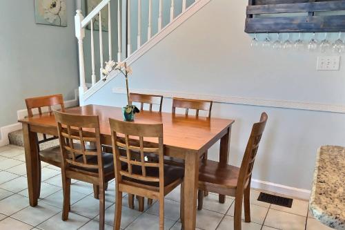 a dining room with a wooden table and chairs at Paradise Duplex B in Gulf Shores
