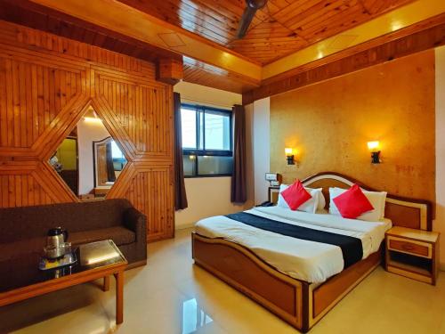 Postel nebo postele na pokoji v ubytování Hotel Pratap Heritage