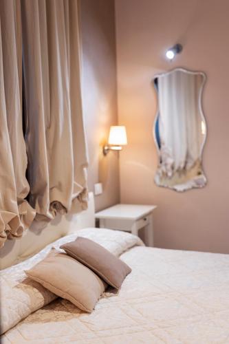 a bed with a pillow on it in a bedroom at Casa Vèra Affittacamere Appartamenti in Orvieto