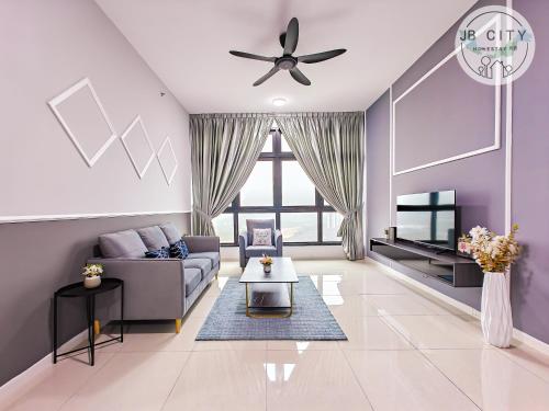 a living room with a couch and a tv at Skudai Paradigm Mall by RR JBcity in Johor Bahru