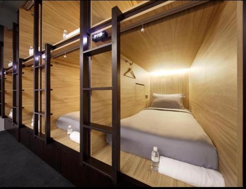 a small room with two bunk beds in it at Huong Thao Hostel & Tours in Dien Bien Phu