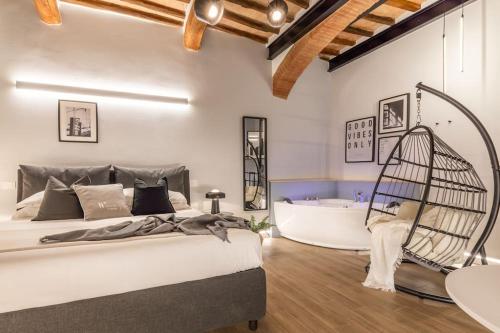 Postel nebo postele na pokoji v ubytování City Life - Idromassaggio nel centro Storico