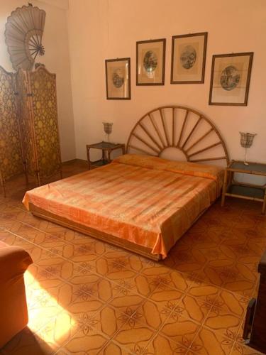 a bedroom with a large bed in a room at Villa Gioia in Carloforte