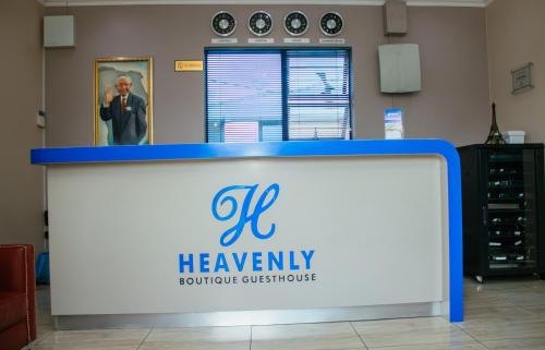 a sign for a hawley boutique customer service at Heavenly Boutique Hotel in Johannesburg