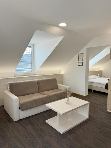 a living room with a couch and a table at Hiša Aleš in Kranj