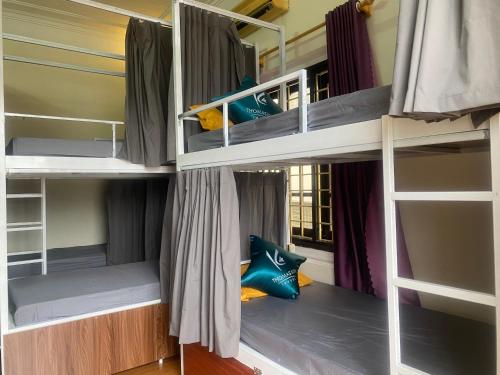 a bedroom with bunk beds in a hostel at Kim's Homestay & Villa in Ha Long