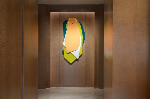 a painting of a surfboard hanging on a wall at W Chengdu in Chengdu