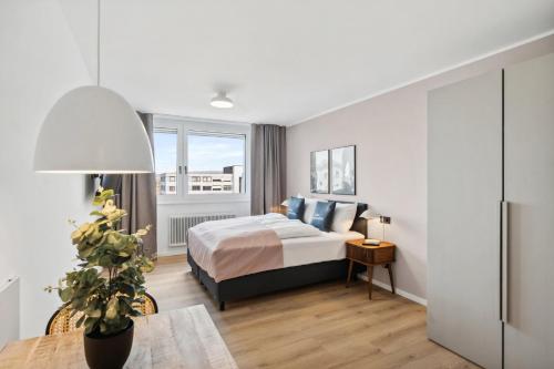 a hotel room with a bed and a window at Limehome Salzburg Sterneckstr in Salzburg