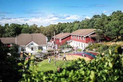 a group of people playing in a park with a playground at Kristiansand Feriesenter in Kristiansand