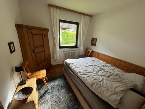 a bedroom with a large bed and a window at Ferienwohnung Lidia Badbruck in Bad Gastein