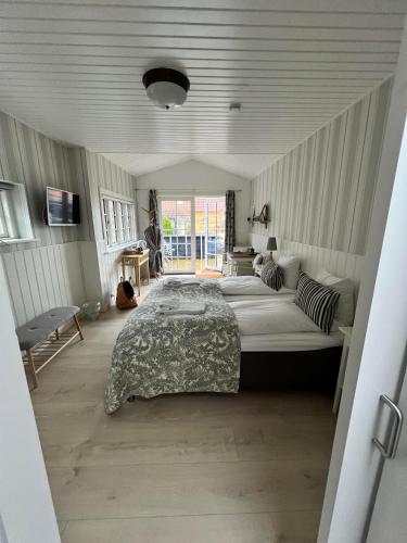 En eller flere senge i et værelse på Hotel Villa Brinkly