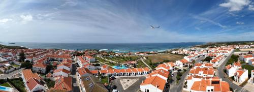 an aerial view of a town with orange roofs at Brisa Mar/Villa Eira Nova in Porto Covo