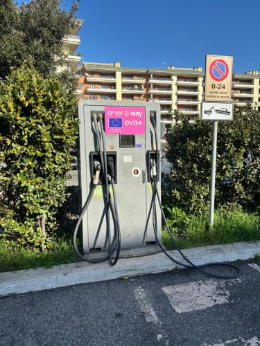 an old gas pump sitting on the side of the road at The Garden Suite Airport in Ponte Galeria