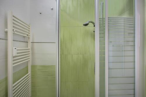 a shower with a glass door in a bathroom at B&Brandi - Sweet Dreams in Florence in Florence