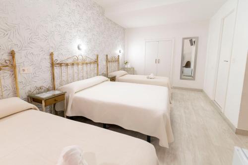 Postel nebo postele na pokoji v ubytování Hotel Manzanito
