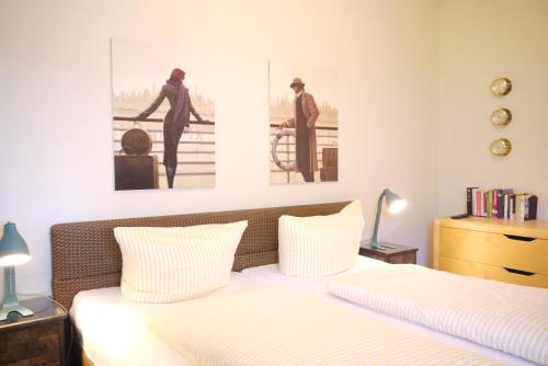 En eller flere senge i et værelse på Dünengras