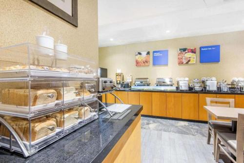 a bakery with a display of pastries on a counter at Comfort Inn & Suites in Collingwood