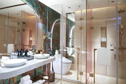 a bathroom with two sinks and a shower at W Chengdu in Chengdu