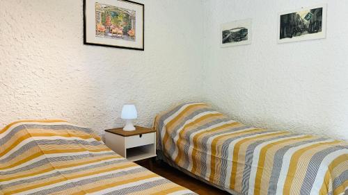 Postel nebo postele na pokoji v ubytování Studio Cocody 6 LUMIO