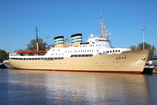 a large cruise ship is docked in the water at Laivahostel S/S Bore in Turku